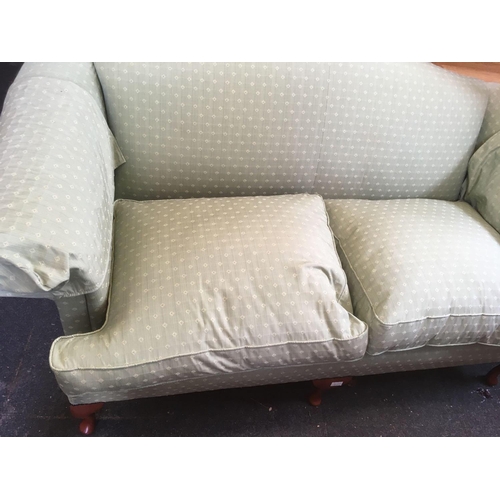 481 - PALE GREEN PATTERNED 3 SEATER SETTEE BY WESLEY-BARRELL ON WOODEN LEGS, 6ft LONG