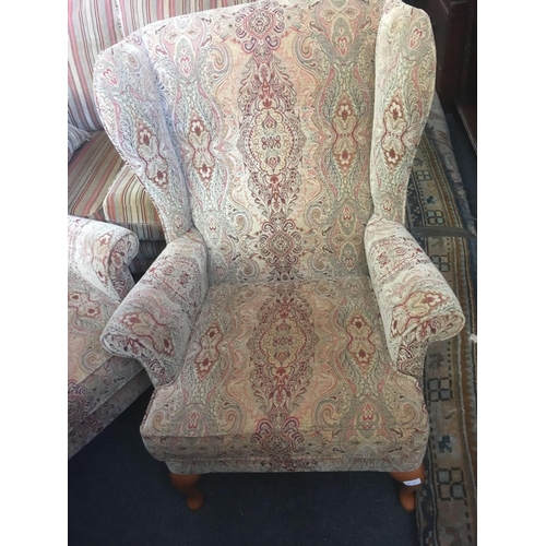 488 - PAIR OF PARKER KNOLL WING BACK PATTERNED ARMCHAIRS