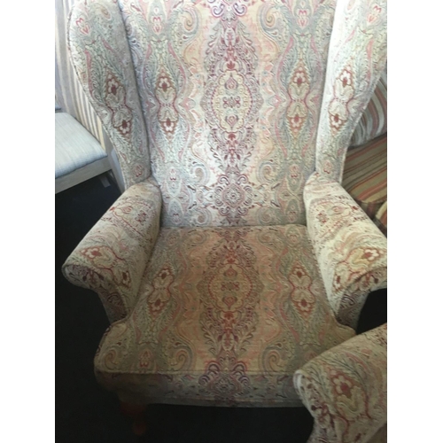 488 - PAIR OF PARKER KNOLL WING BACK PATTERNED ARMCHAIRS