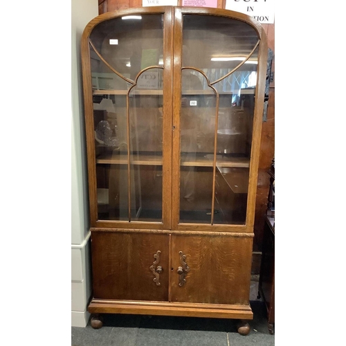 242 - ART DECO CARVED OAK DISPLAY CABINET WITH CUPBOARDS UNDER, 34'' WIDE