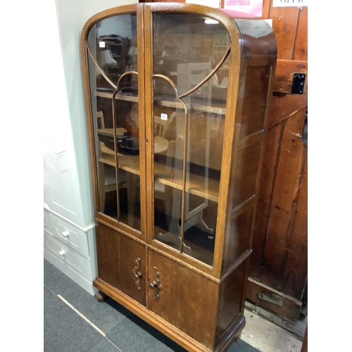 242 - ART DECO CARVED OAK DISPLAY CABINET WITH CUPBOARDS UNDER, 34'' WIDE