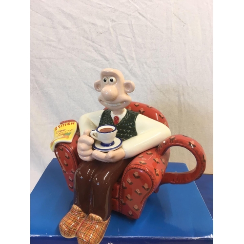 919 - 2 WALLACE & GROMIT TEA POTS, PUMPKIN TEA POT & WALLACE IN ARMCHAIR TEA POT