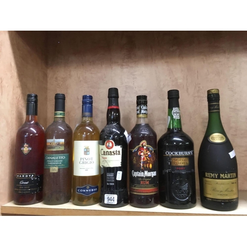 944 - 3 BOTTLES OF WHITE ROSE WINE, BOTTLE OF CAPTAIN MORGAN RUM, COLBORNE SPECIAL RESERVE PORT, REMY MART... 