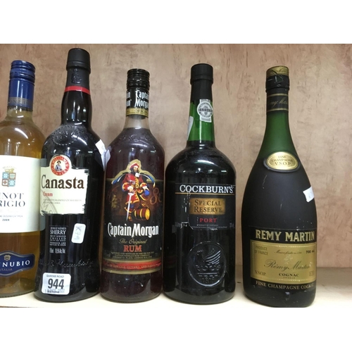 944 - 3 BOTTLES OF WHITE ROSE WINE, BOTTLE OF CAPTAIN MORGAN RUM, COLBORNE SPECIAL RESERVE PORT, REMY MART... 