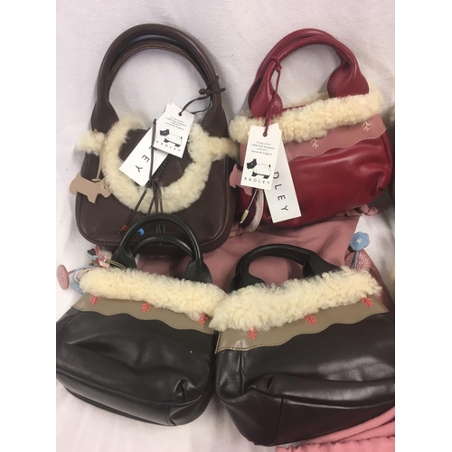 29 - 8 SMALL HANDBAGS BEARING THE NAME OF RADLEY WITH SHEEPSKIN TRIM IN NEW CONDITION WITH LABELS