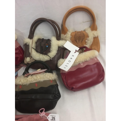 29 - 8 SMALL HANDBAGS BEARING THE NAME OF RADLEY WITH SHEEPSKIN TRIM IN NEW CONDITION WITH LABELS