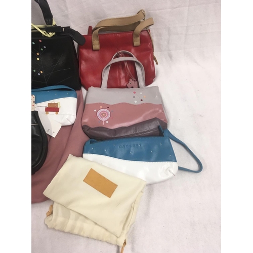 39 - 8 SMALL DARK COLOURED HANDBAGS IN NEW CONDITION, SOME WITH LABELS BEARING THE NAME ''RADLEY''