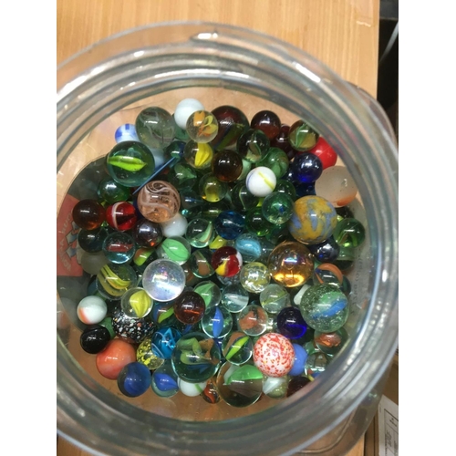 146 - JAR OF MISC GLASS MARBLES