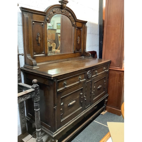 253 - CARVED OAK SIDEBOARD WITH MIRRORED BACK, BRASS DROP HANDLES, 4ft 6'' WIDE