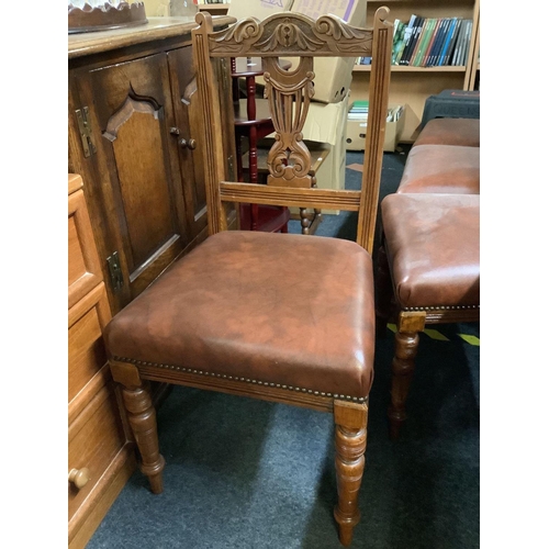 309 - 4 MATCHING LEATHERETTE SEAT DINING CHAIRS WITH LYRE BACKS