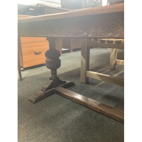 291 - LOW OAK CARVED TABLE WITH UNUSUAL CARVED PEDESTAL LEGS, 52'' X 22''