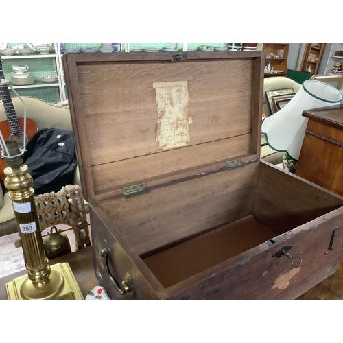 390 - SMALL VICTORIAN OAK COFFER WITH HINGED LID & BRASS PLAQUE, REV. CASTLETON MILLER WITH THE REMAINS OF... 