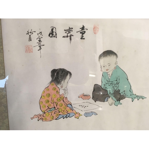 510 - HAND-COLOURED ORIENTAL PRINT OF TWO SEATED CHILDREN PLAYING A GAME WITH BEAD COUNTERS.  SIGNED WITH ... 