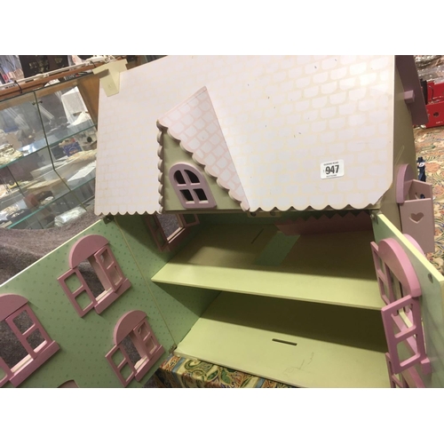 947 - PINK WOODEN DOLLS HOUSE WITH 2 LARGE BOXES OF FURNITURE