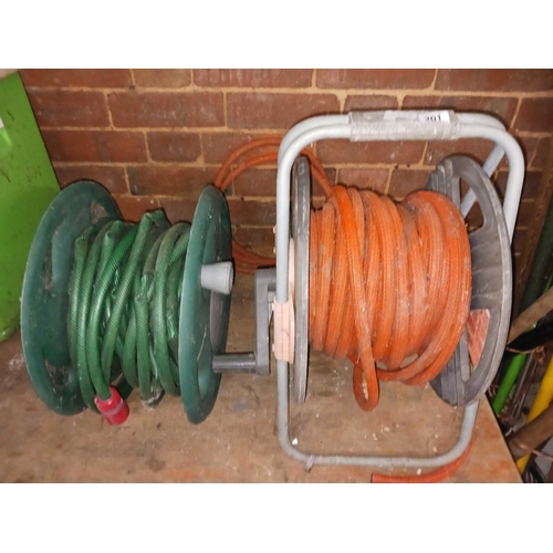 201 - 2 GARDEN HOSES ON REELS, 1 ON A STAND