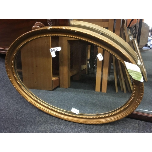 500 - GILT FRAMED OVAL MIRROR & A BEVELLED EDGE OVER MANTLE MIRROR