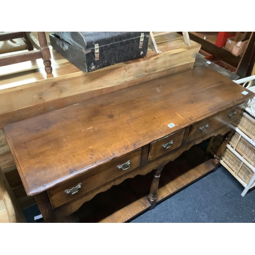 342 - STRESSED OAK CARVED SIDE TABLE WITH 3 DRAWERS ON PILLAR LEGS