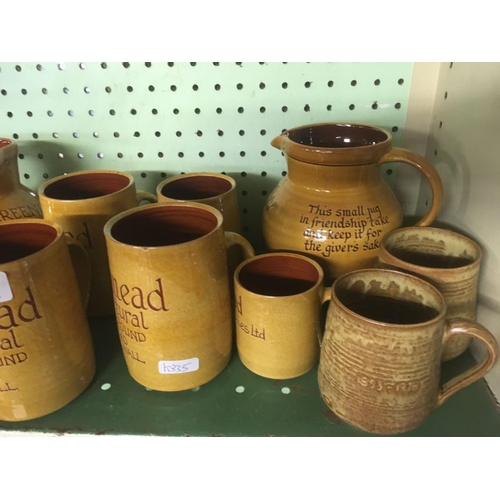 434 - 1 SHELF OF POTTERY MUGS & JUGS