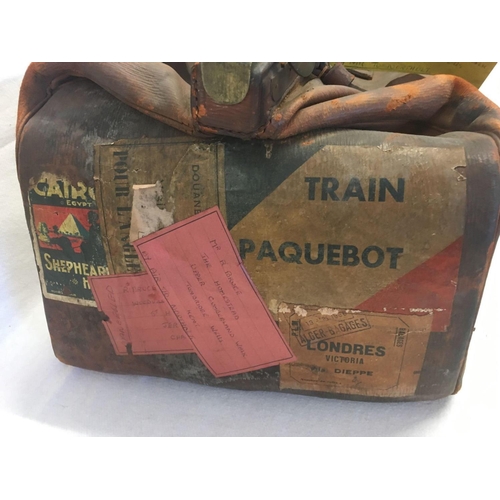 658 - VINTAGE LEATHER TRAVEL BAG WITH LABELS A/F