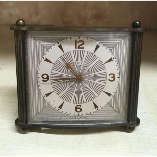 957 - SMALL BRASS FRAMED DRESSING TABLE CLOCK