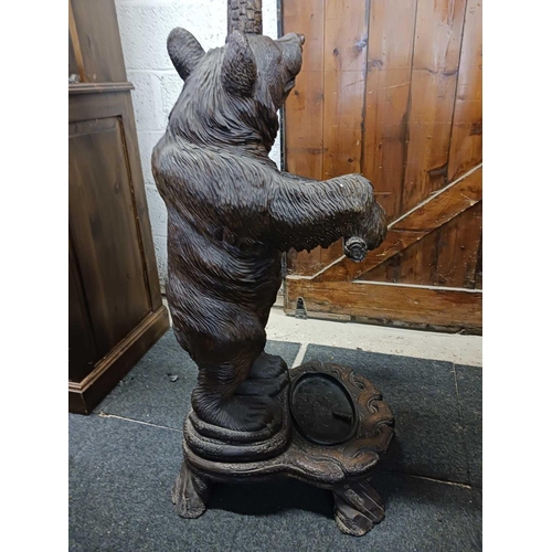 260 - WOODEN SOUTH GERMAN CARVED HALL STAND IN FORM OF A BEAR STANDING ON HIND LEGS WITH AN OVAL METAL DRI... 