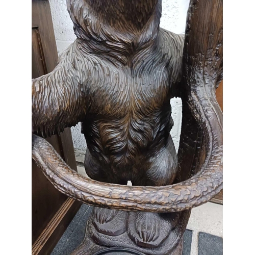 260 - WOODEN SOUTH GERMAN CARVED HALL STAND IN FORM OF A BEAR STANDING ON HIND LEGS WITH AN OVAL METAL DRI... 