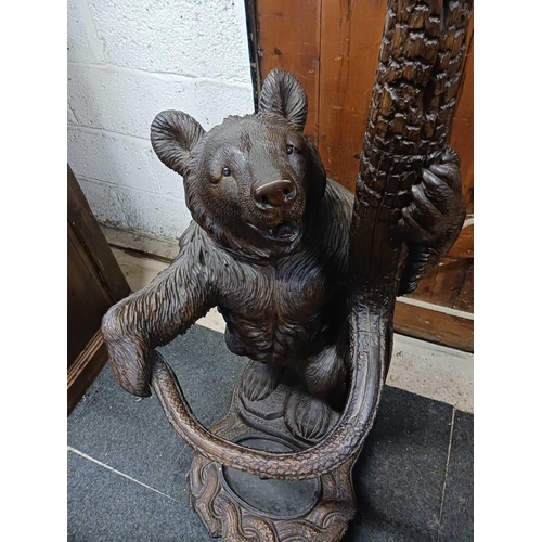 260 - WOODEN SOUTH GERMAN CARVED HALL STAND IN FORM OF A BEAR STANDING ON HIND LEGS WITH AN OVAL METAL DRI... 