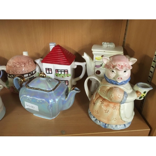 283 - SHELF OF NOVELTY TEA POTS