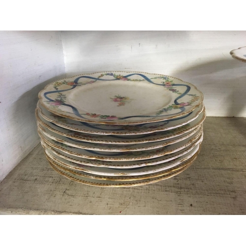 416 - 2 SHELVES OF CHINA PLATES WITH FIGURINE'S ETC