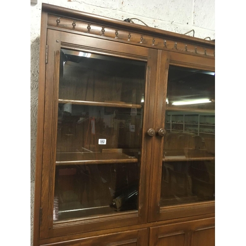 592 - ERCOL GLAZED DISPLAY CABINET, 77'' HIGH X 38'' ACROSS APPROX X 17'' DEPTH