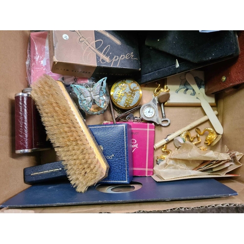 152 - SMALL CARTON WITH HAIR CLIPPERS, HIP FLASK, LEATHER WALLETS, TINS & OTHER BRIC-A-BRAC