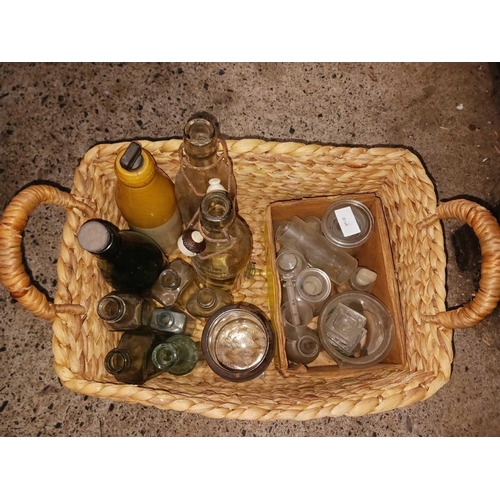 39 - REED BASKET WITH VINTAGE BOTTLES