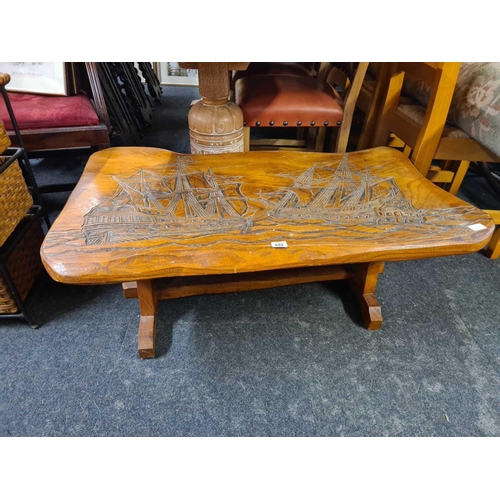 442 - COFFEE TABLE WITH CARVINGS DEPICTING SAILING SHIPS