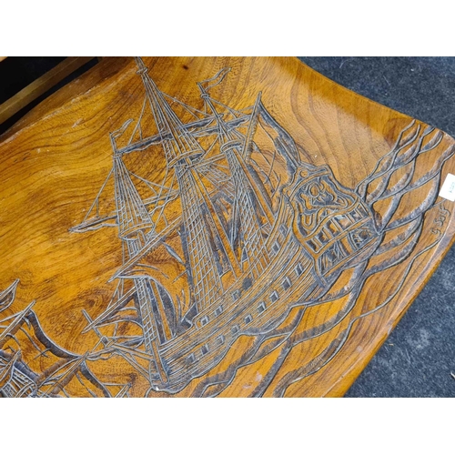 442 - COFFEE TABLE WITH CARVINGS DEPICTING SAILING SHIPS