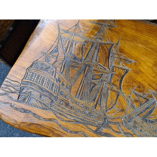 442 - COFFEE TABLE WITH CARVINGS DEPICTING SAILING SHIPS