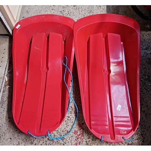 207 - 2 RED PLASTIC SLEIGH BOARDS