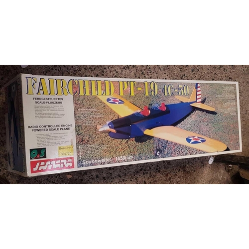 66 - A FAIR CHILD PT-19 4C - 50 RADIO CONTROLLED AIRCRAFT KIT IN BOX, NOT KNOWN IF COMPLETE