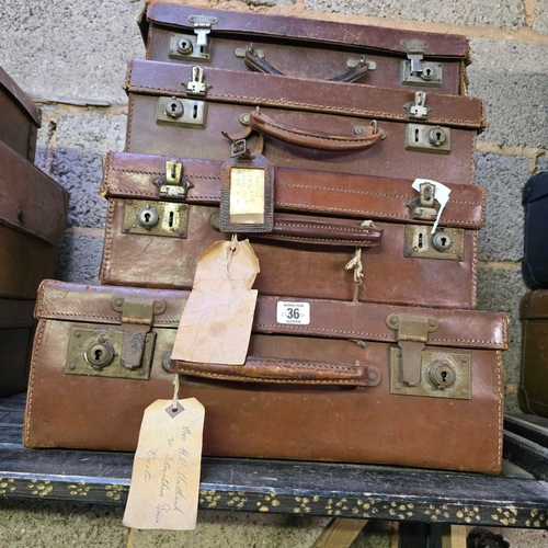 36 - SET OF 4 GRADUATED LEATHER SUITCASES