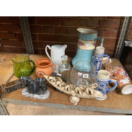 189 - SHELF OF VARIOUS JUGS, VASES, STEINS, BOOKENDS ETC