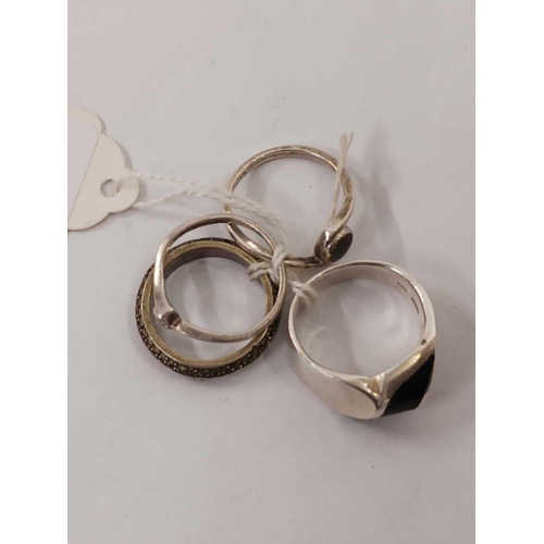 813 - FOUR VARIOUS SILVER MOUNTED RINGS