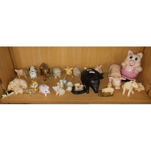 252 - SHELF OF ORNAMENTAL PIGS