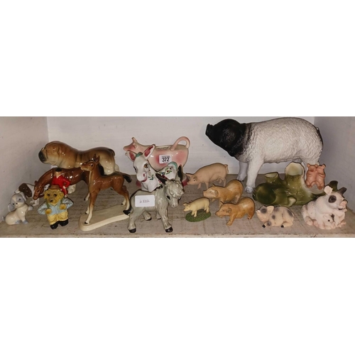 372 - SHELF OF ANIMAL FIGURES, PIGS ETC