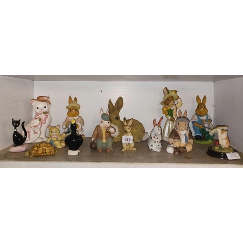 373 - SHELF OF ANIMAL FIGURES MOSTLY OF RABBITS ETC