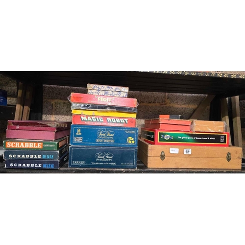 52 - SHELF OF MISC BOARD GAMES INCL; SCRABBLE, TRIVIA PURSUIT, A BOXED BACK GAMMON & AN INDOOR BOULE'S SE... 