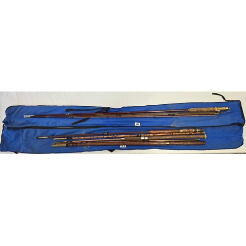 983 - 4 CANE FISHING RODS IN BLUE BAGS