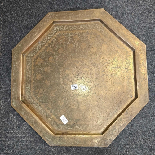 122 - BRASS ENGRAVED OCTAGONAL TRAY, 24'' ACROSS