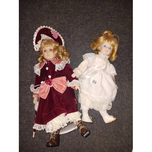 258 - 2 DRESSED DOLLS