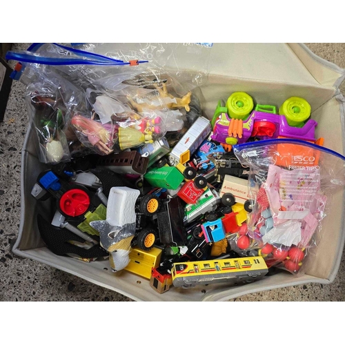 34 - LAUNDRY CASE CONTAINING PLASTIC TOYS, TRAINS & ANIMALS