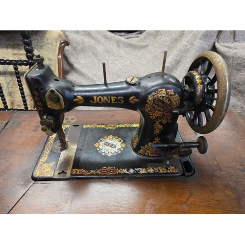 665 - SEWING MACHINE WITH CAST IRON LEGS & TABLE