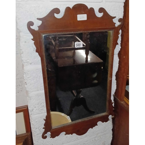 340 - RECTANGULAR MIRROR IN A PIERCED MAHOGANY SURROUND